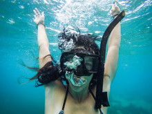 Woman Underwater In Snorkel Mask With Bubbles