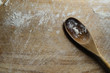 Wooden Spoon on Floured Chopping Board