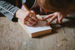 © Sergey Filimonov/Stocksy - Woman carpenter makes a sketch of the future work