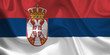 Waving flag of the Serbia. Serbian Flag in the Wind. Serbian National mark. Waving Serbia Flag. Serbia Flag Flowing.