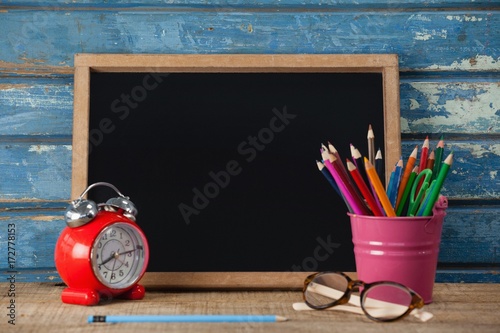 Fotografia, Obraz Slate, alarm clock, penholder, pencil and spectacle