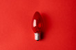 Red Light bulb on red background