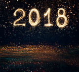 Fototapeta Sypialnia - 2018 written with Sparkle firework on black background , 2018 Happy New Year background concept.