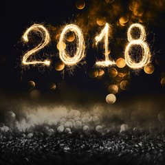 Wall Mural - 2018 written with sparkle firework on black background , 2018 happy new year background concept.