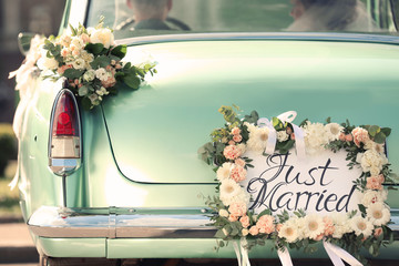beautiful wedding car with plate just married