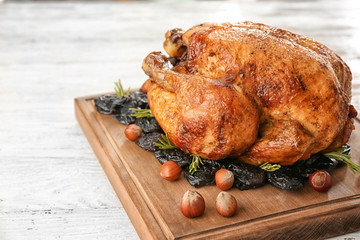 Wall Mural - Roasted turkey with prune and nuts on wooden board