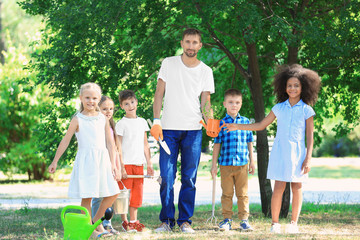 Wall Mural - Group of children with teacher in park