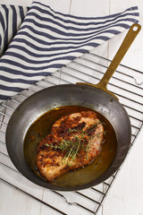 Wall Mural - grilled pork chop with oil in a pan