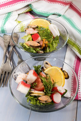 Wall Mural - seafood salad served in a glass bowl