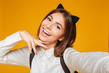 Wall Mural - Close up portrait of a pretty teenage schoolgirl