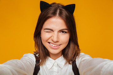 Wall Mural - Close up portrait of a pretty teenage schoolgirl in uniform