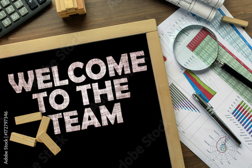 Fotomural Text Welcome to the team on the blackboard on the desk with office business acce