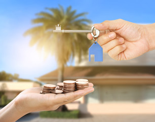 Investment concept ,House key in hand