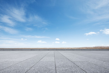 Wall Mural - empty marble floor with snow mountains