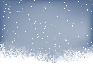 Wall Mural - Winter background. Wave border made of fluffy snowflakes with space for text on soft blue background with falling snow.