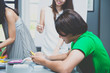 © gballgiggs - Group of young freelancer working together,people in college library