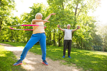 Canvas Print - Senior Couple Exercising In Park
