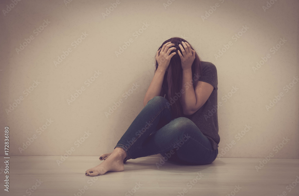 sad woman hug her knee and cry. The depression woman sit on the floor ...