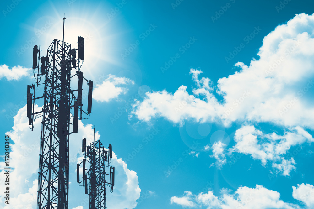 communication tower or 3G 4G network telephone cellsite silhouette on blue sky and space for text