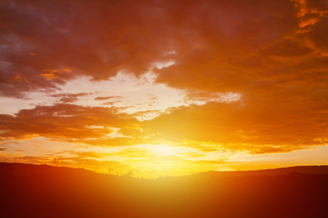 Wall Mural - bright orange sky clouds before rain at sunset. cloud on sunset for background