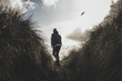 © Evan Dalen/Stocksy - Young Man Running Up Coastal Trail