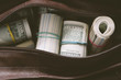 © Alexey Kuzma/Stocksy - leather bag with cash