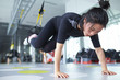© Bonaoke/Stocksy - young asian woman in gym