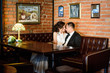© Nestyda - Wedding couple indoors is hugging each other. Beautiful model girl in white dress. Man in suit. Beauty bride with groom. Female and male portrait. Cute lady and handsome guy