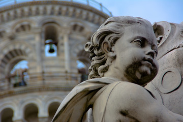 tower and sculpture in Pisa