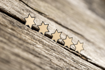 Wall Mural - five stars in a row on a rustic wooden boards