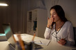 © Syda Productions - tired woman with papers yawning at night office