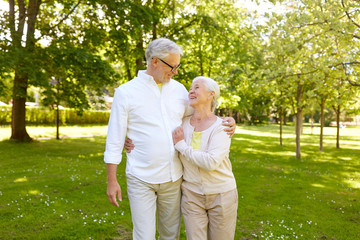 Sticker - happy senior couple hugging in city park