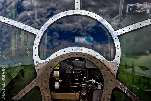 Tela The sky reflecting off the front of a World War Two bomber’s cockpit