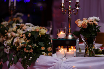 Main table at a wedding reception lit with fairy lights