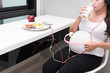 pregnant woman take care of herselft, drinking milk, eat healthy meal,