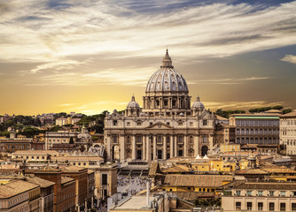 view from above of the vatican and st. peter's cathedral at sunset