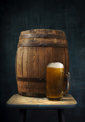 Wall Mural - Beer barrel with glasses on table wooden background