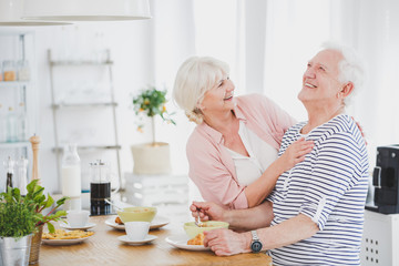 Poster - Senior woman hugs husband