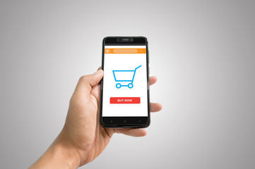 Online shopping sceen on phone background. Smartphone with cart.