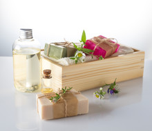 Essential Oil And Handmade Soap And Towels In Wooden Box