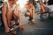 © Jacob Lund/Stocksy - Friends with skateboards having fun