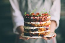 Delicious Cake; Naked Cake With Berries And Whipped Cream Decorated With Mint Leaves