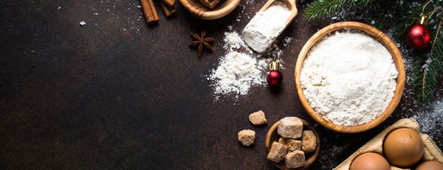 Wall Mural - Ingredients for cooking christmas  baking. Top view on dark stone table.