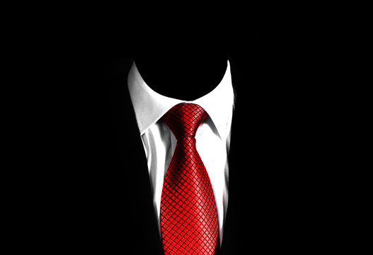 Fototapete - business man suit with a red tie on a black background