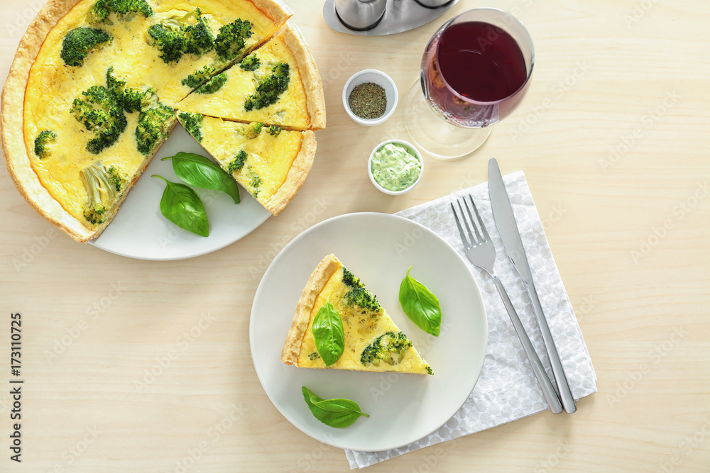 Tasty broccoli quiche on table