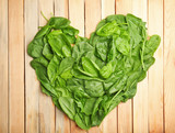 Fototapeta Kuchnia - Fresh spinach leaves on wooden background