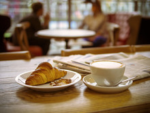 Coffee, Croissant, Newspapers. Morning At The Cafe