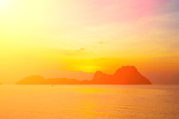 Wall Mural - Bright colors at dawn on the beach at sunrise in the Gulf of Thailand.