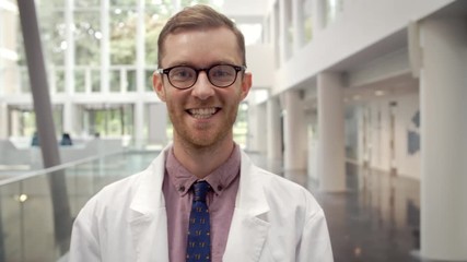 Wall Mural - Portrait Of Smiling Male Doctor In Lobby Of Hospital