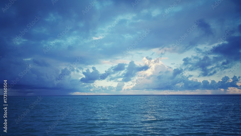 Sea sunrise over the atlantic ocean. Rainy clouds. - obrazy, fototapety, plakaty 